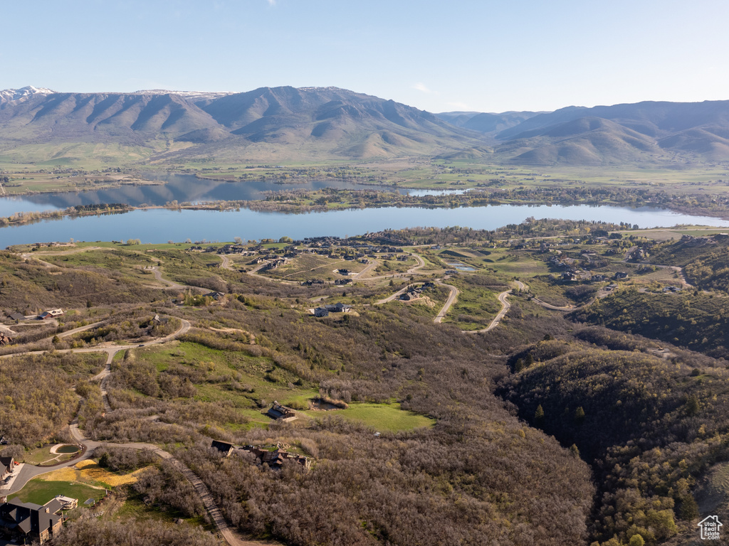 Property view of mountains with a water view