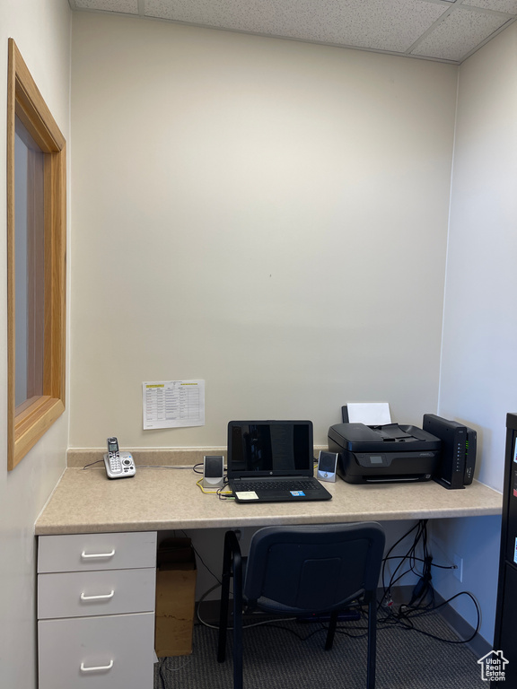 Office featuring a paneled ceiling