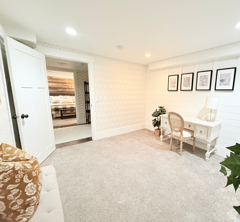 Living area featuring carpet flooring and recessed lighting
