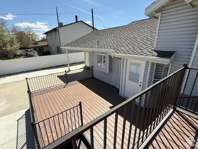 Wooden deck featuring fence