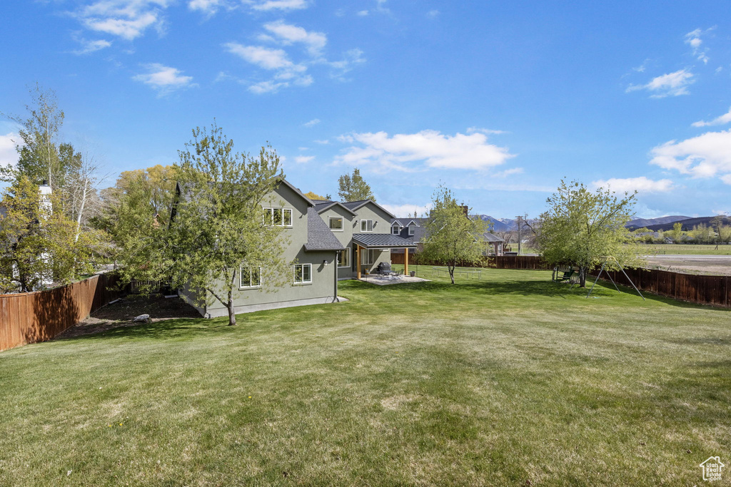 View of yard with a fenced backyard