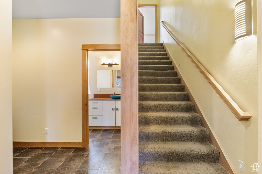 Stairway featuring baseboards