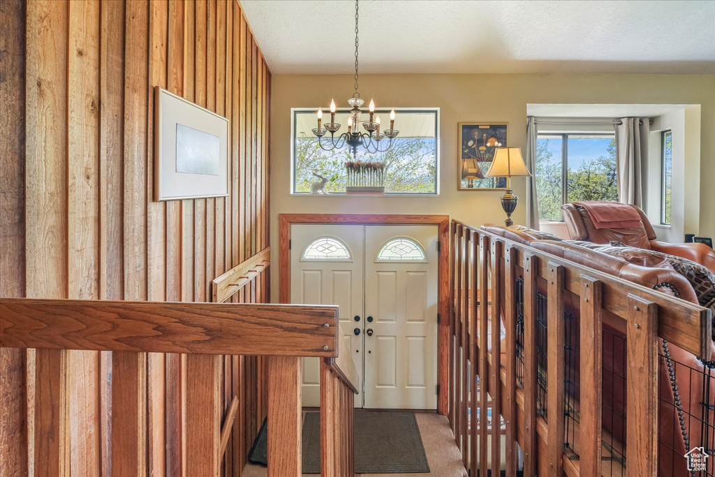 Entryway with a notable chandelier