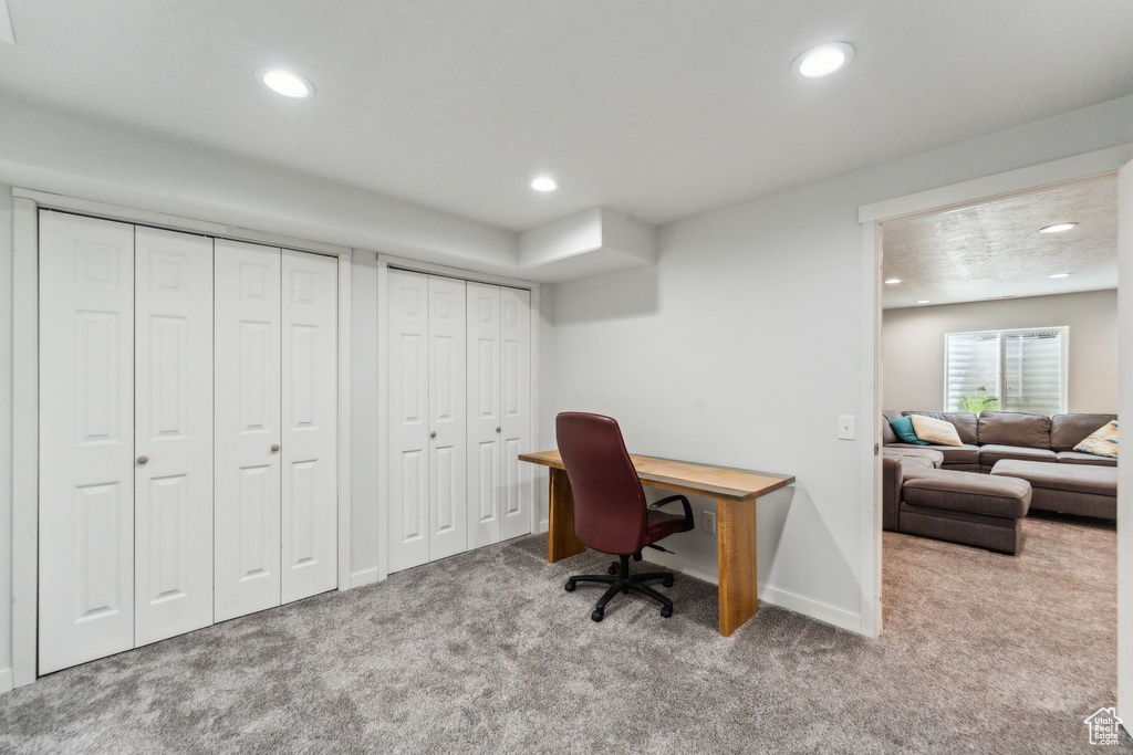 Carpeted office with baseboards and recessed lighting