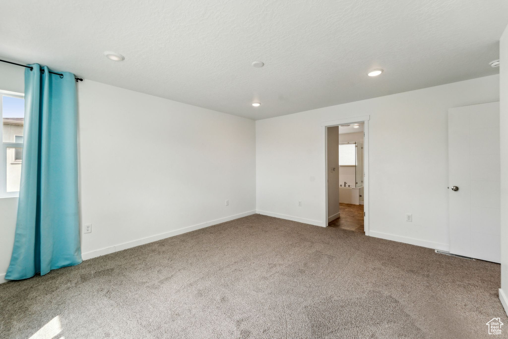 Unfurnished bedroom featuring carpet flooring, recessed lighting, and baseboards
