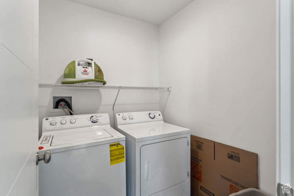 Washroom featuring washer and dryer and laundry area