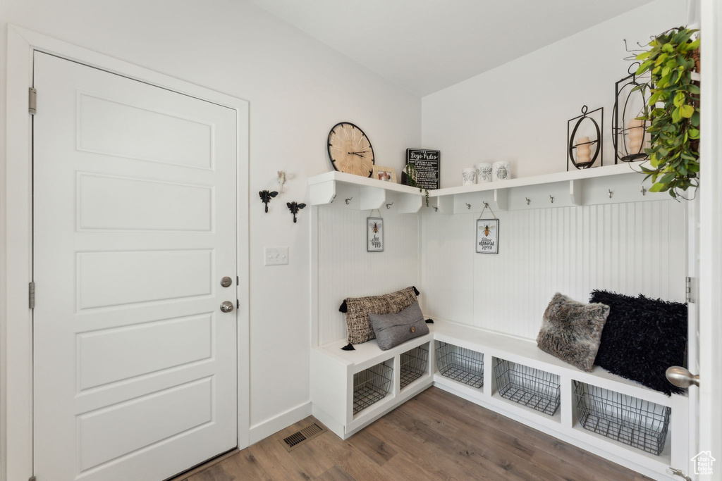 Mudroom featuring visible vents and wood finished floors