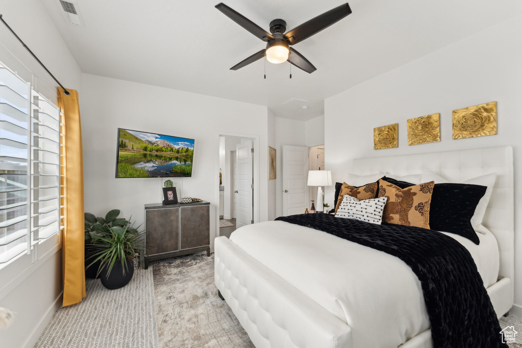 Bedroom with a ceiling fan and baseboards