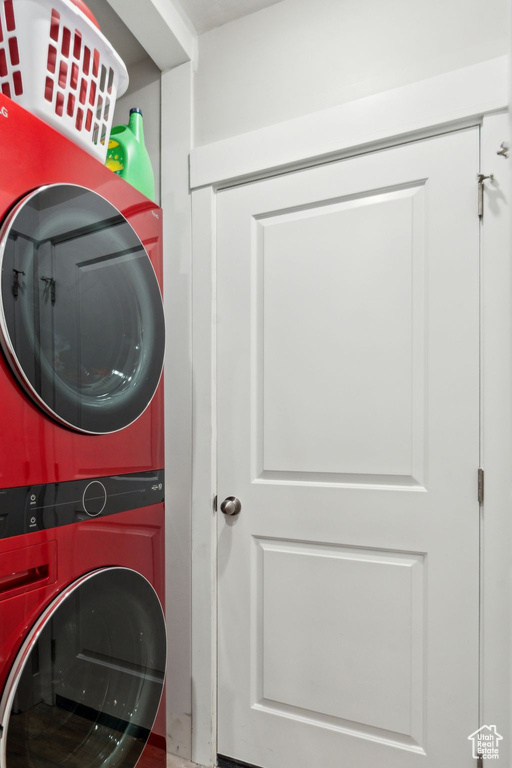 Washroom featuring laundry area and stacked washer and dryer