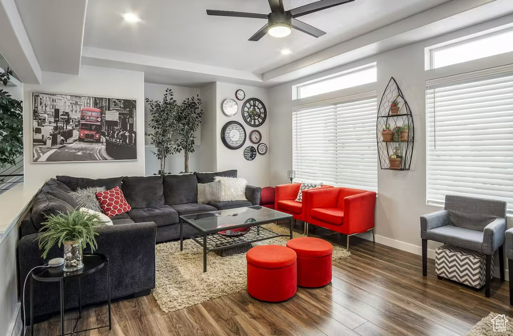 Living room featuring baseboards, ceiling fan, recessed lighting, and wood finished floors