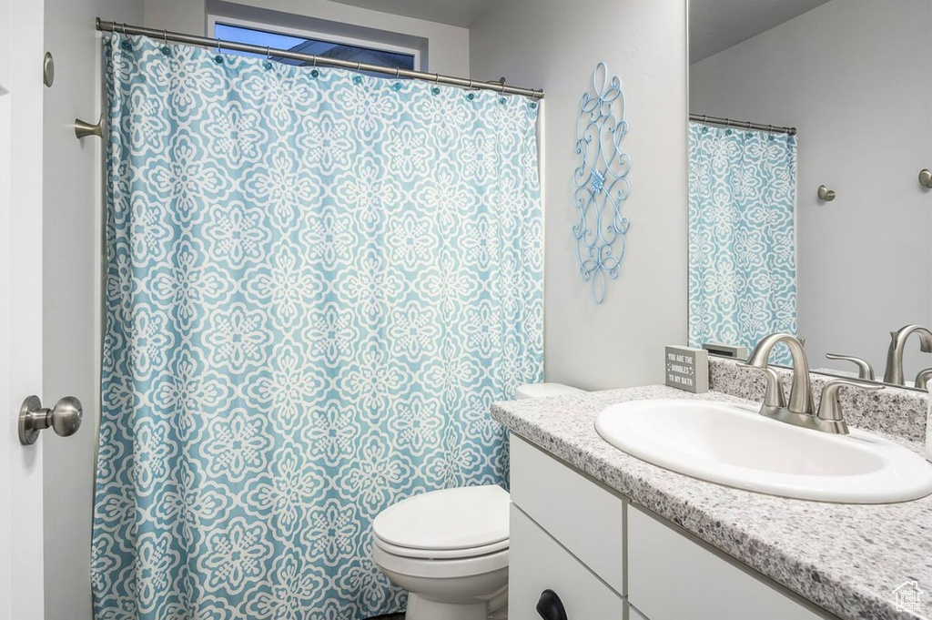 Bathroom featuring toilet and vanity
