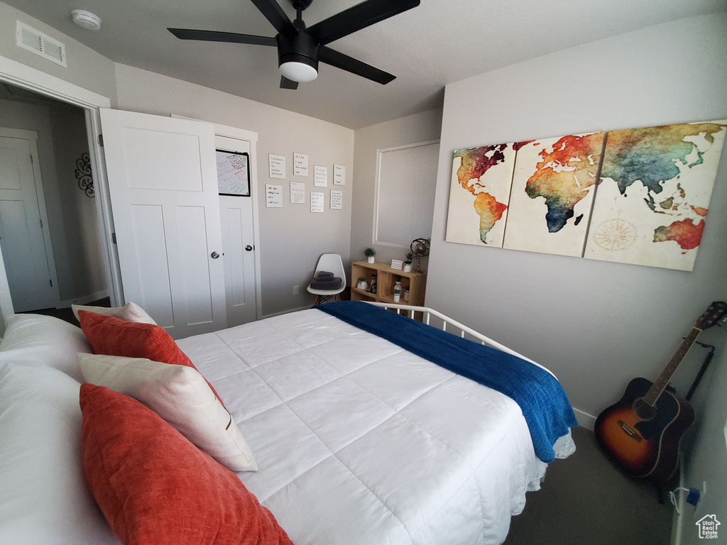 Bedroom with ceiling fan and visible vents