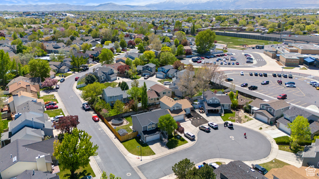 Birds eye view of property featuring a mountain view and a residential view