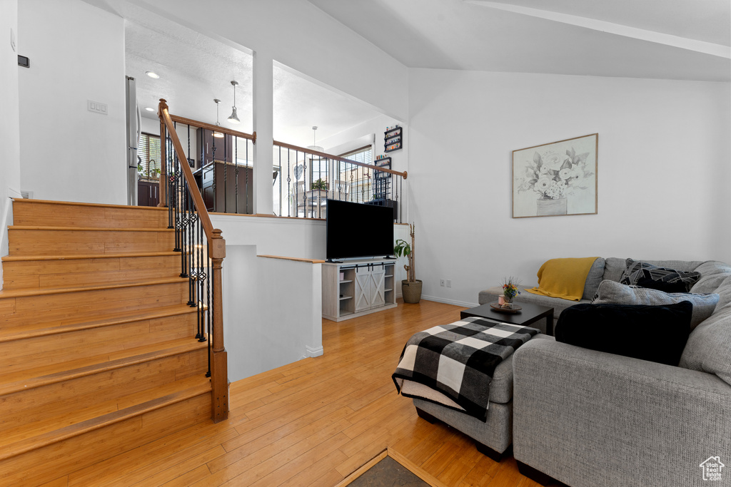 Living area featuring wood finished floors and stairway