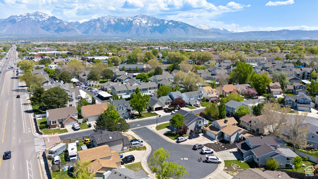 Birds eye view of property with a mountain view and a residential view