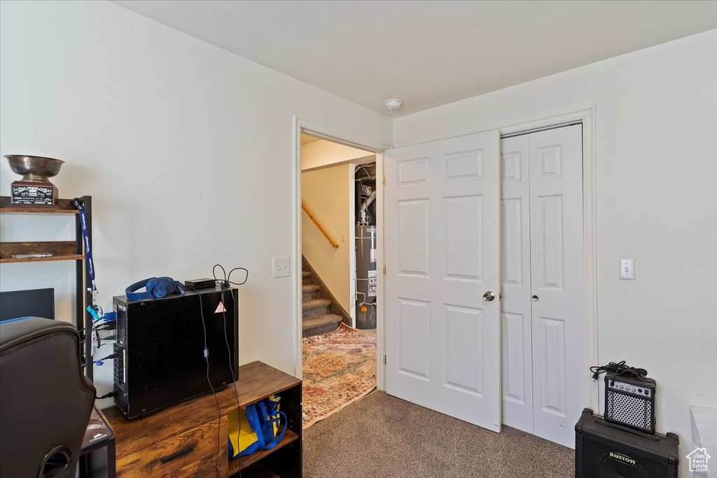 Carpeted office with gas water heater