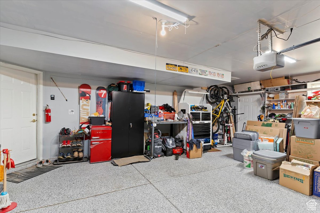 Garage featuring a garage door opener