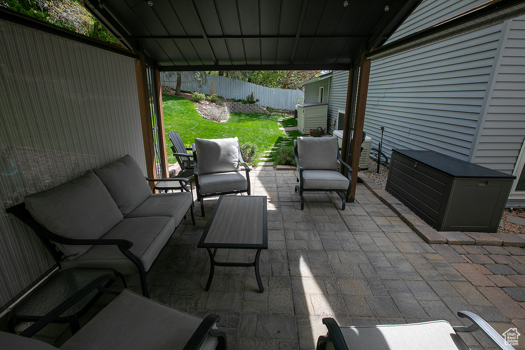 View of patio / terrace featuring fence and an outdoor hangout area
