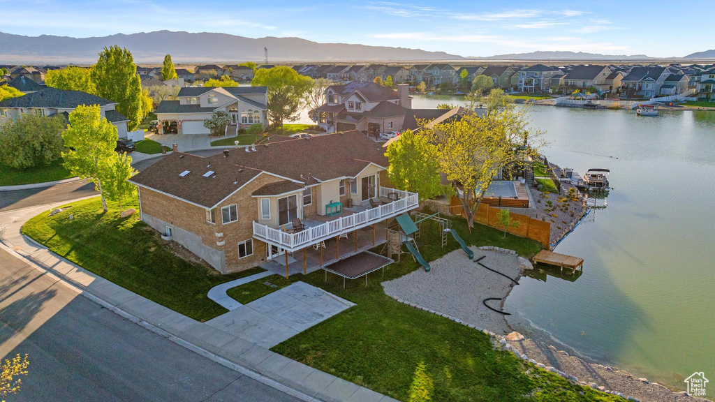 Aerial view featuring a residential view and a water and mountain view