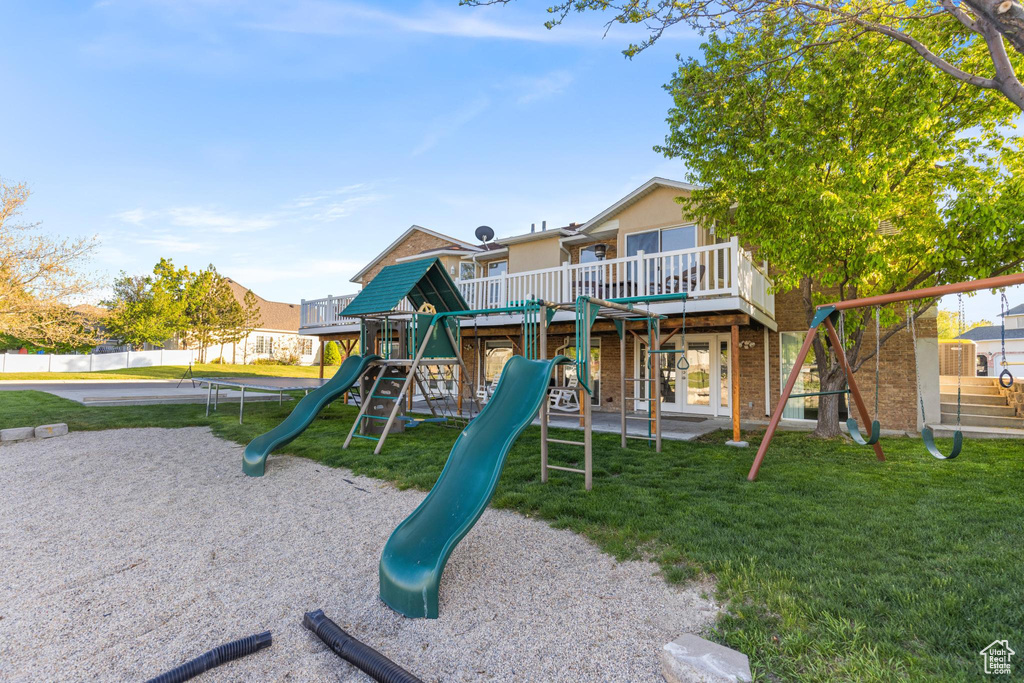View of play area with a lawn