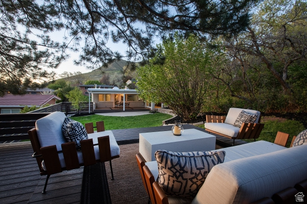 View of patio / terrace with a deck with mountain view, outdoor lounge area, and outdoor dining space