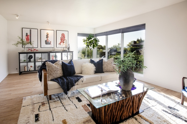Living room with light wood-style floors and baseboards