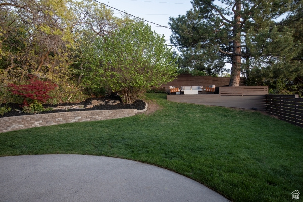 View of yard with a patio area and fence