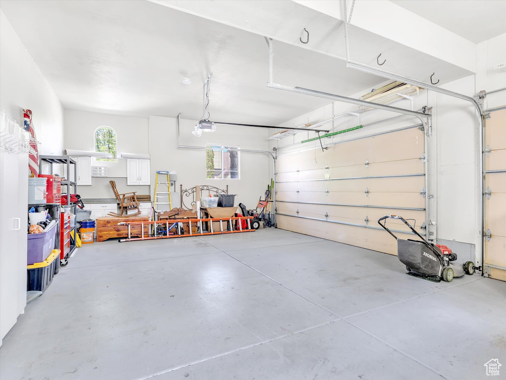 Garage featuring a garage door opener