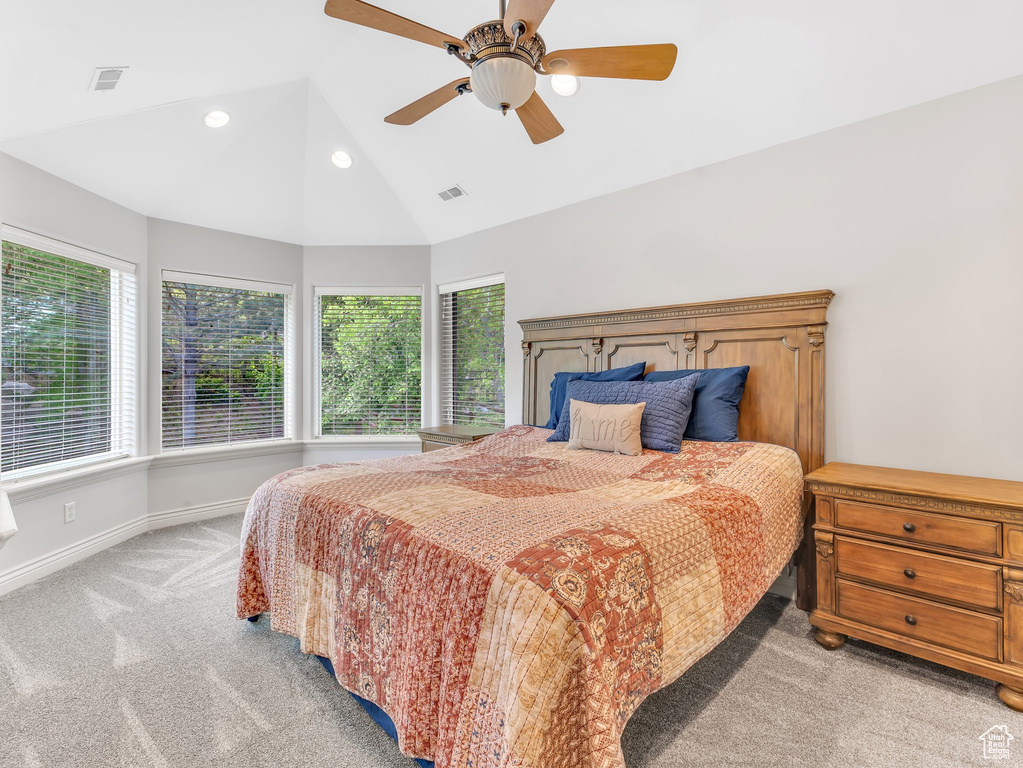 Bedroom featuring light carpet, lofted ceiling, baseboards, ceiling fan, and recessed lighting