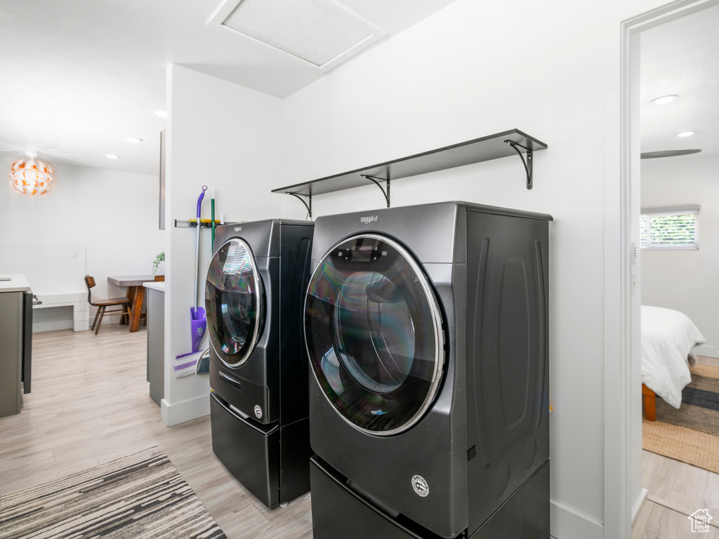 Laundry room with laundry area, attic access, recessed lighting, light wood-type flooring, and washer and clothes dryer