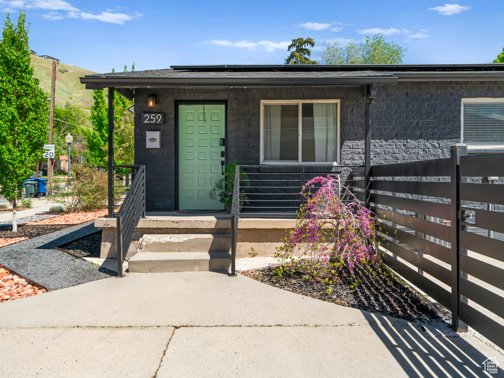 Doorway to property with covered porch