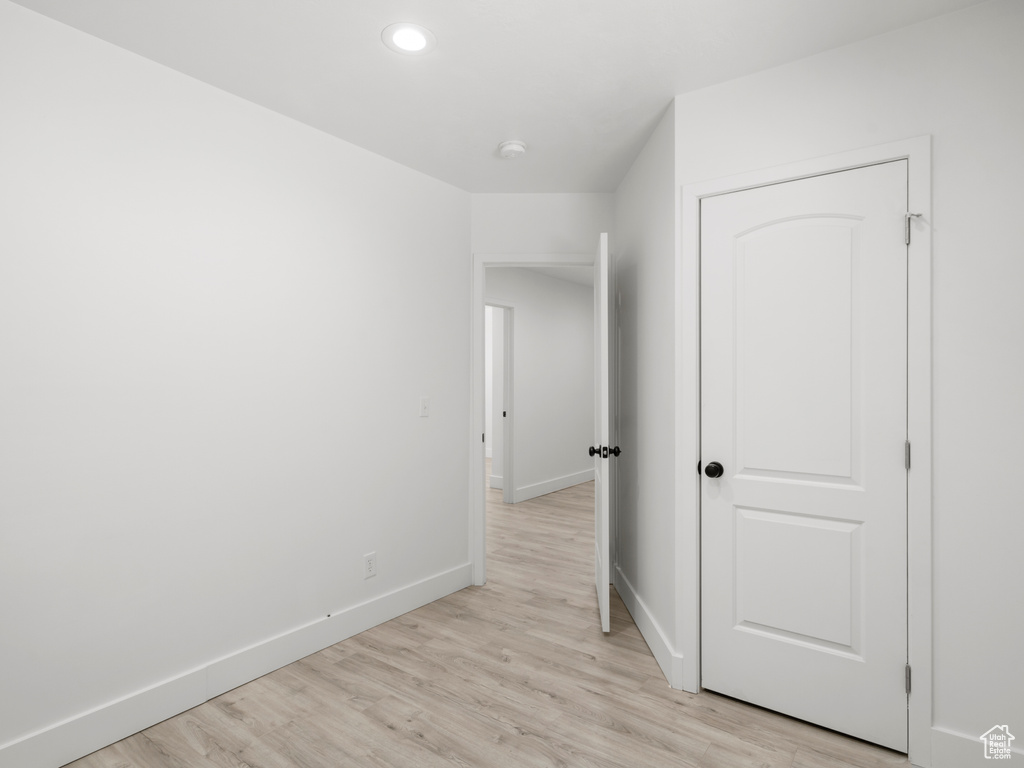 Interior space with recessed lighting, baseboards, and light wood finished floors