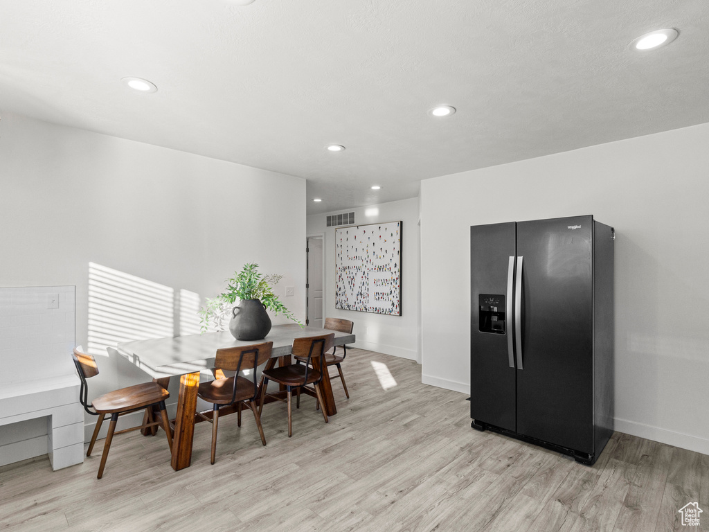 Dining area with visible vents, recessed lighting, and light wood finished floors
