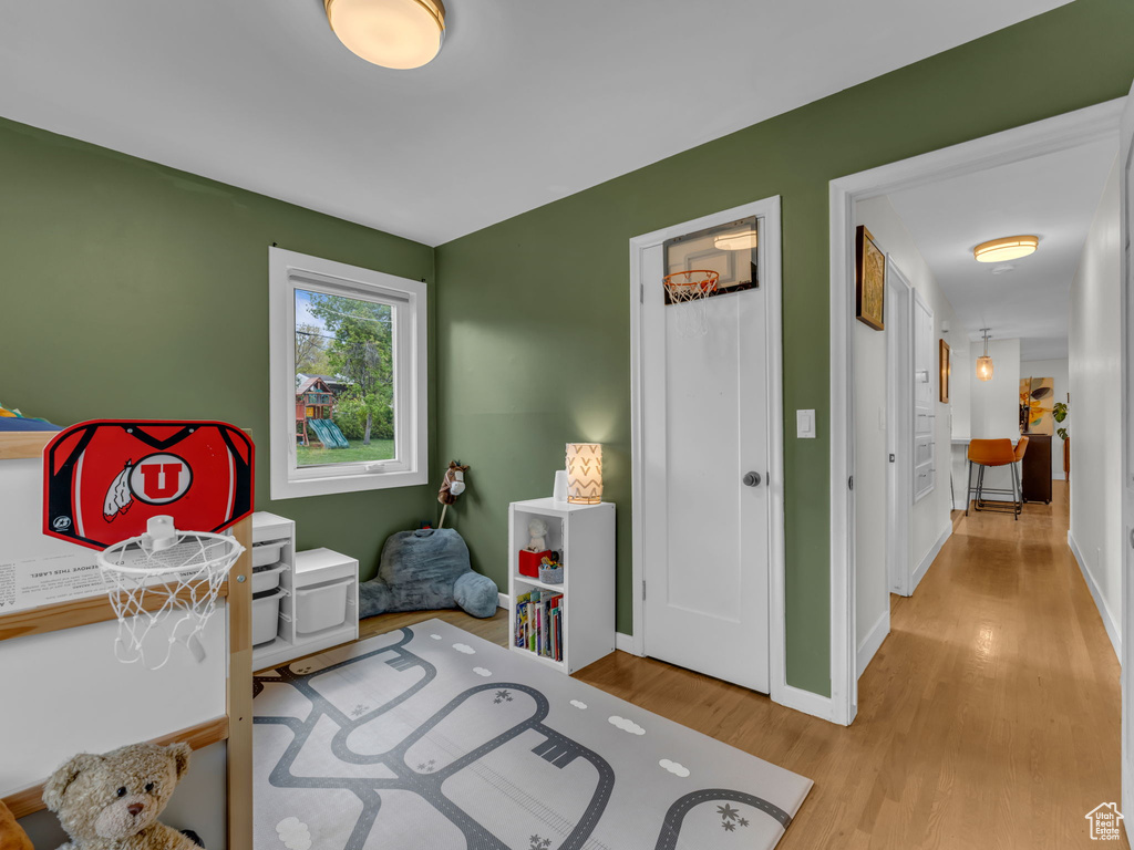 Bedroom featuring baseboards and wood finished floors