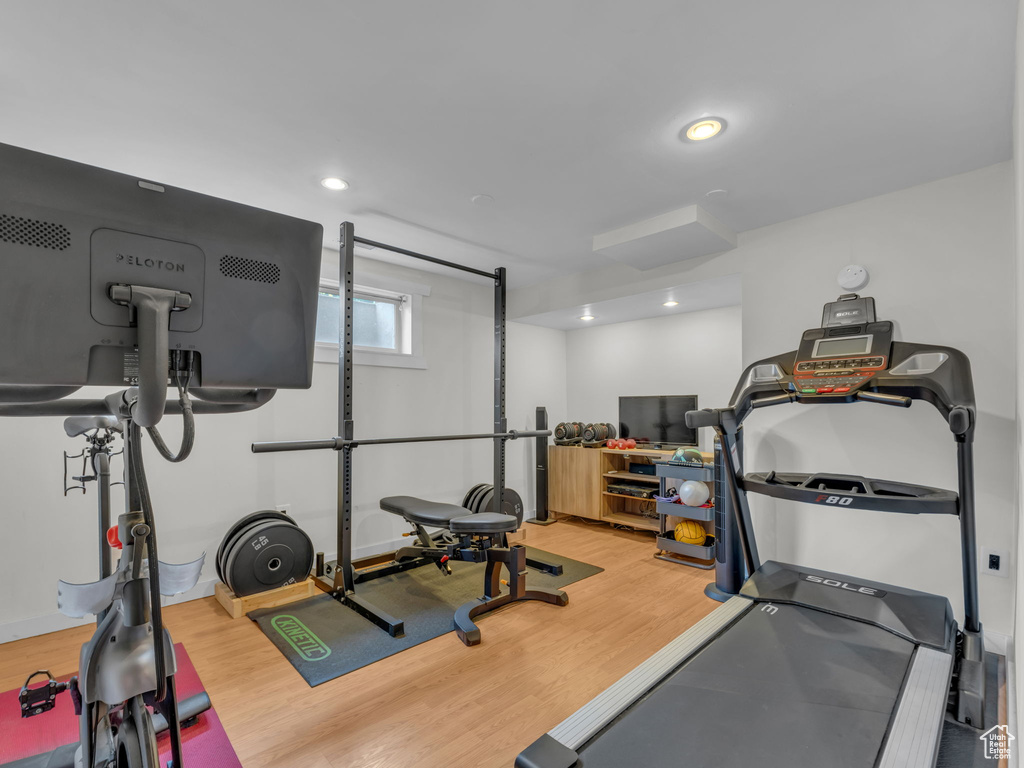 Exercise room featuring recessed lighting and wood finished floors