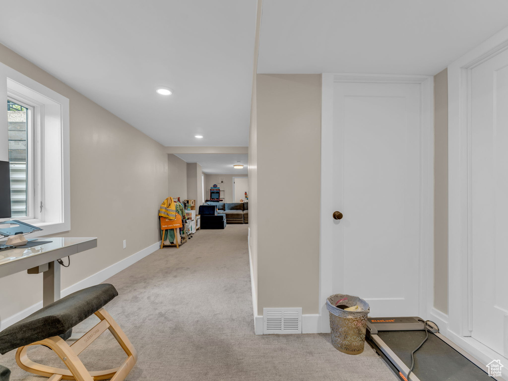 Interior space featuring baseboards, recessed lighting, and visible vents