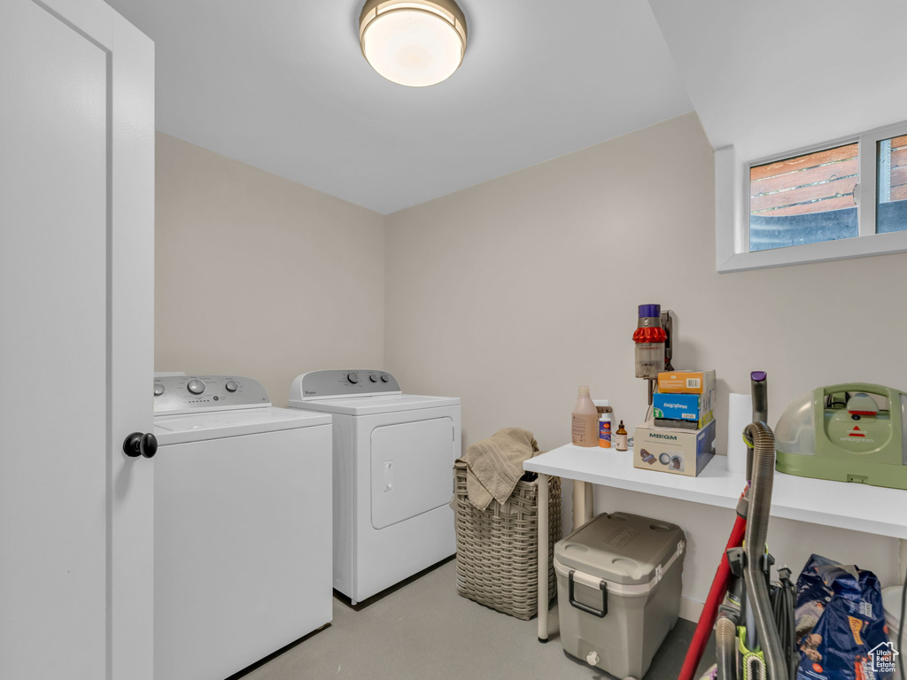 Washroom with washer and dryer and laundry area