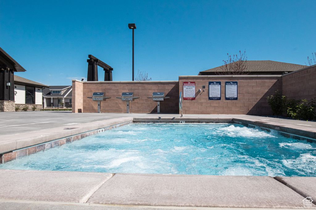 View of swimming pool featuring a pool
