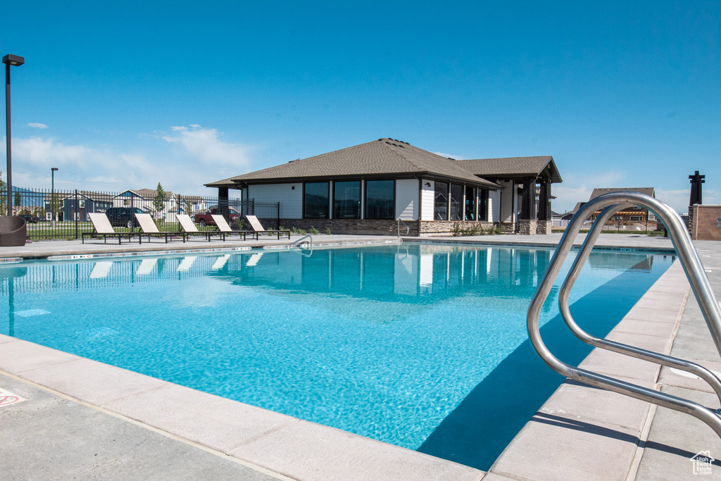 Community pool featuring fence