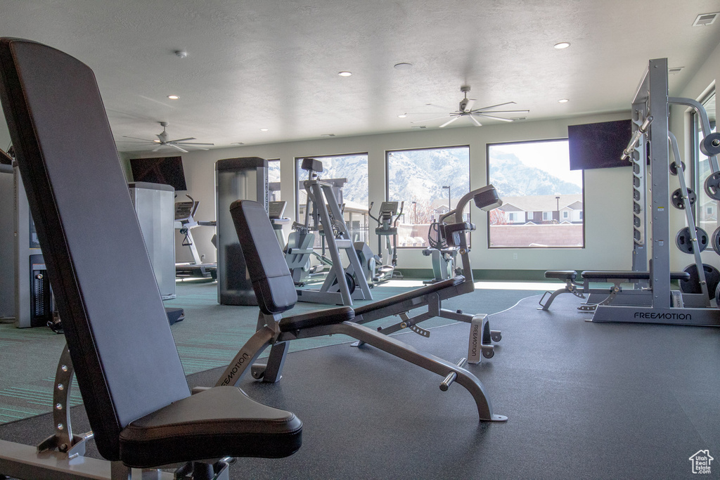 Gym with recessed lighting, a ceiling fan, baseboards, and visible vents