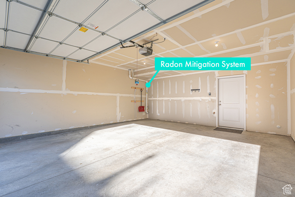 Garage featuring a garage door opener