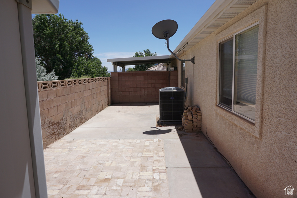 View of patio / terrace featuring fence and central air condition unit