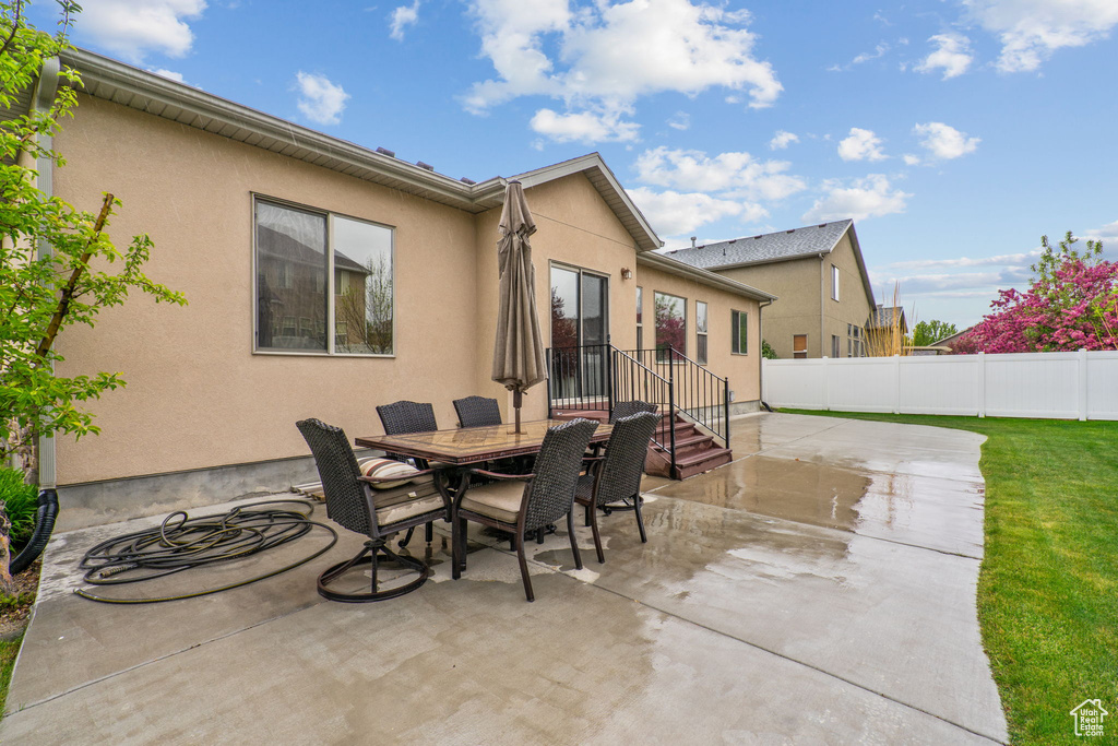 View of patio / terrace featuring fence and outdoor dining space