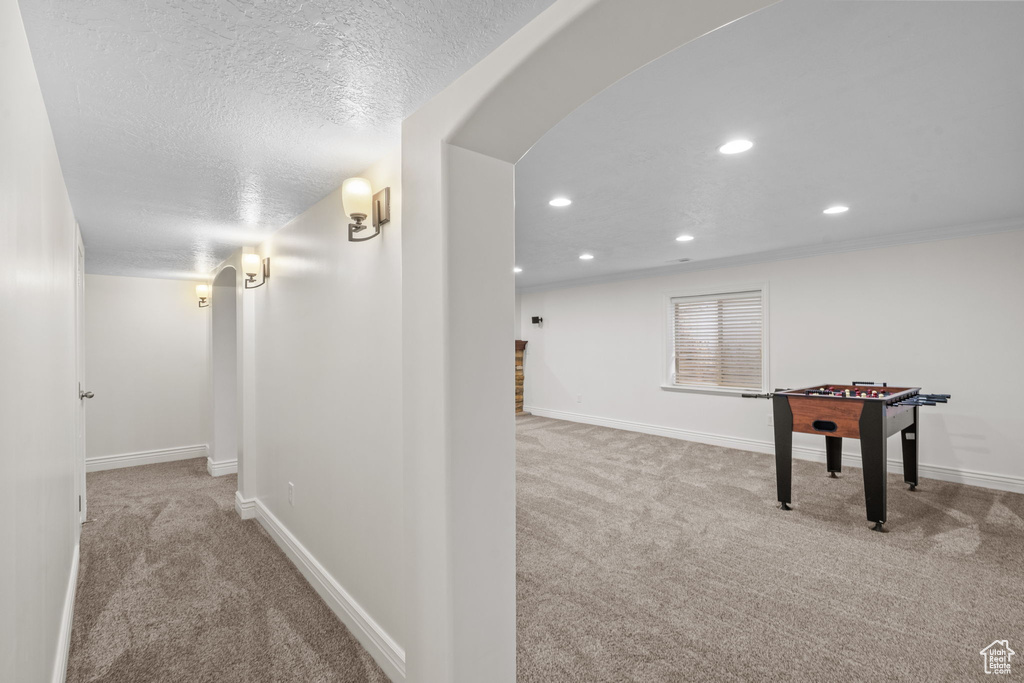 Interior space with carpet floors, recessed lighting, and baseboards