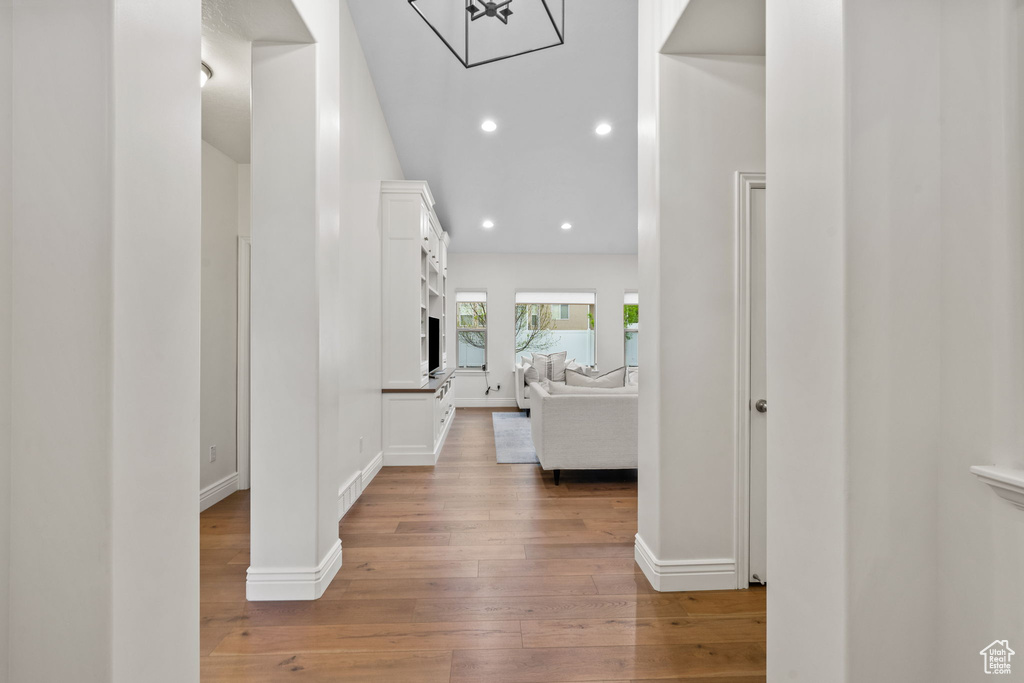 Hall featuring recessed lighting, baseboards, and hardwood / wood-style flooring