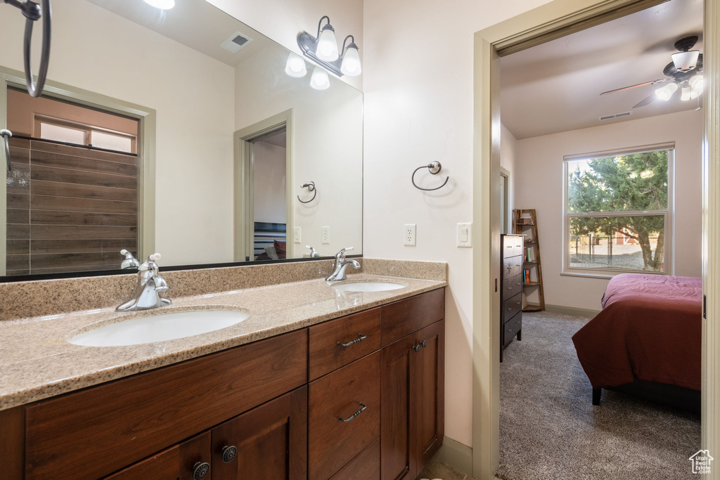 Full bathroom with a sink, a ceiling fan, ensuite bath, and visible vents