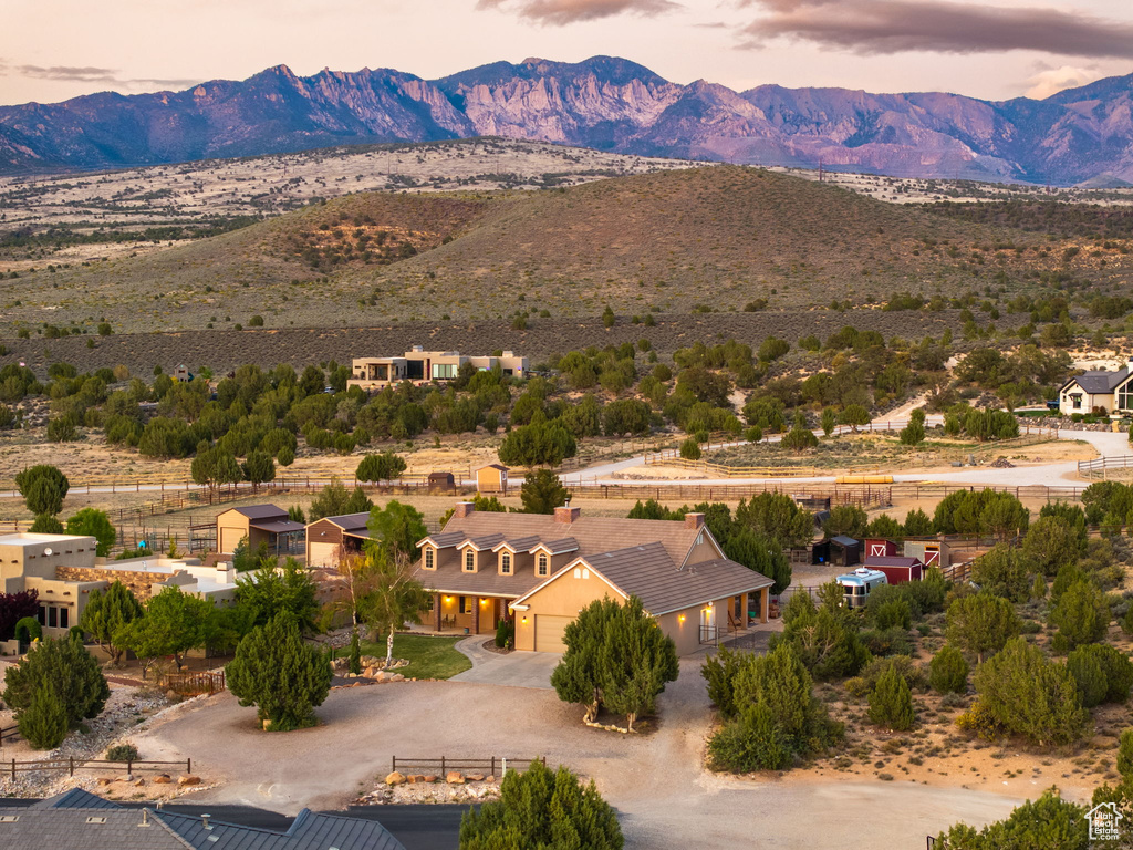 Birds eye view of property with a mountain view