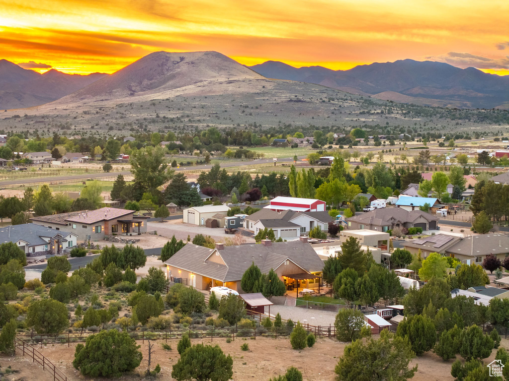 Aerial view at dusk featuring a mountain view