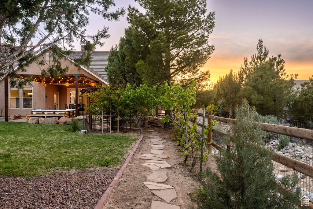 Yard at dusk with fence