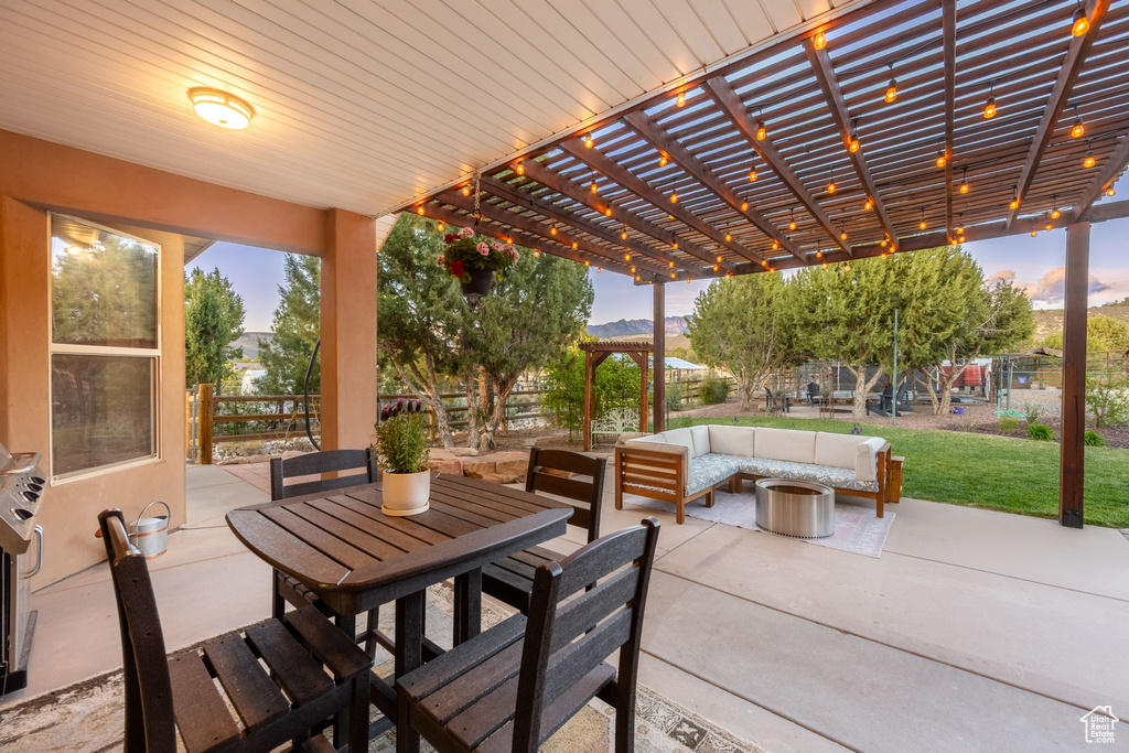 View of patio / terrace featuring a pergola, outdoor lounge area, a fenced backyard, and outdoor dining space